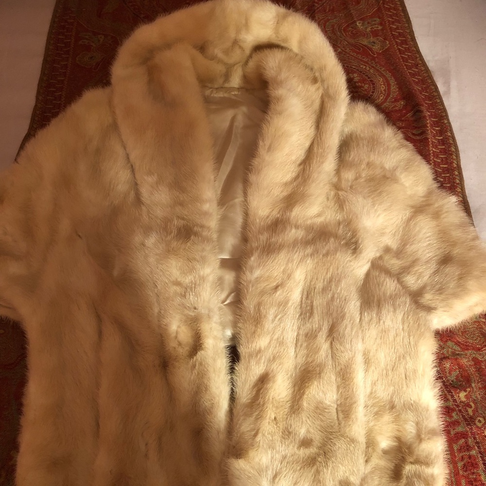 A golden fur cape stole
